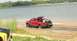Big Red Ford coming to a stop at shore mud drag